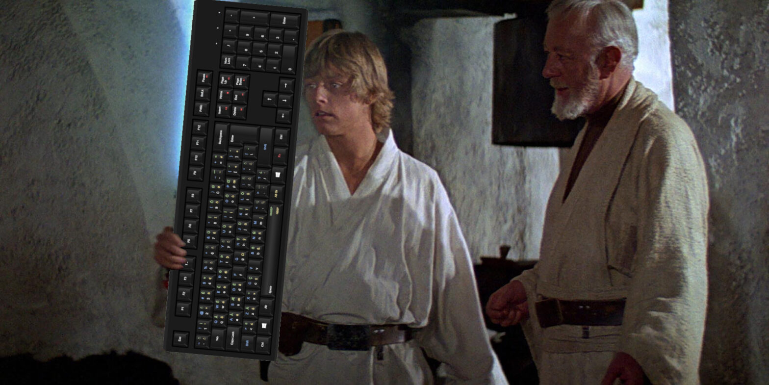 Luke and Obi-Wan Kenobi looking at a keyboard